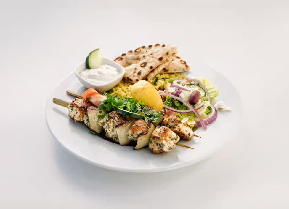 Grilled chicken skewers with sides
