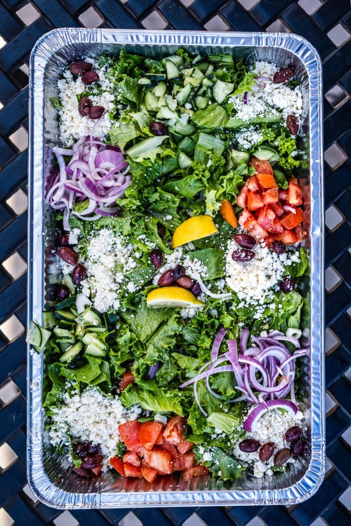 Colorful salad in aluminum tray